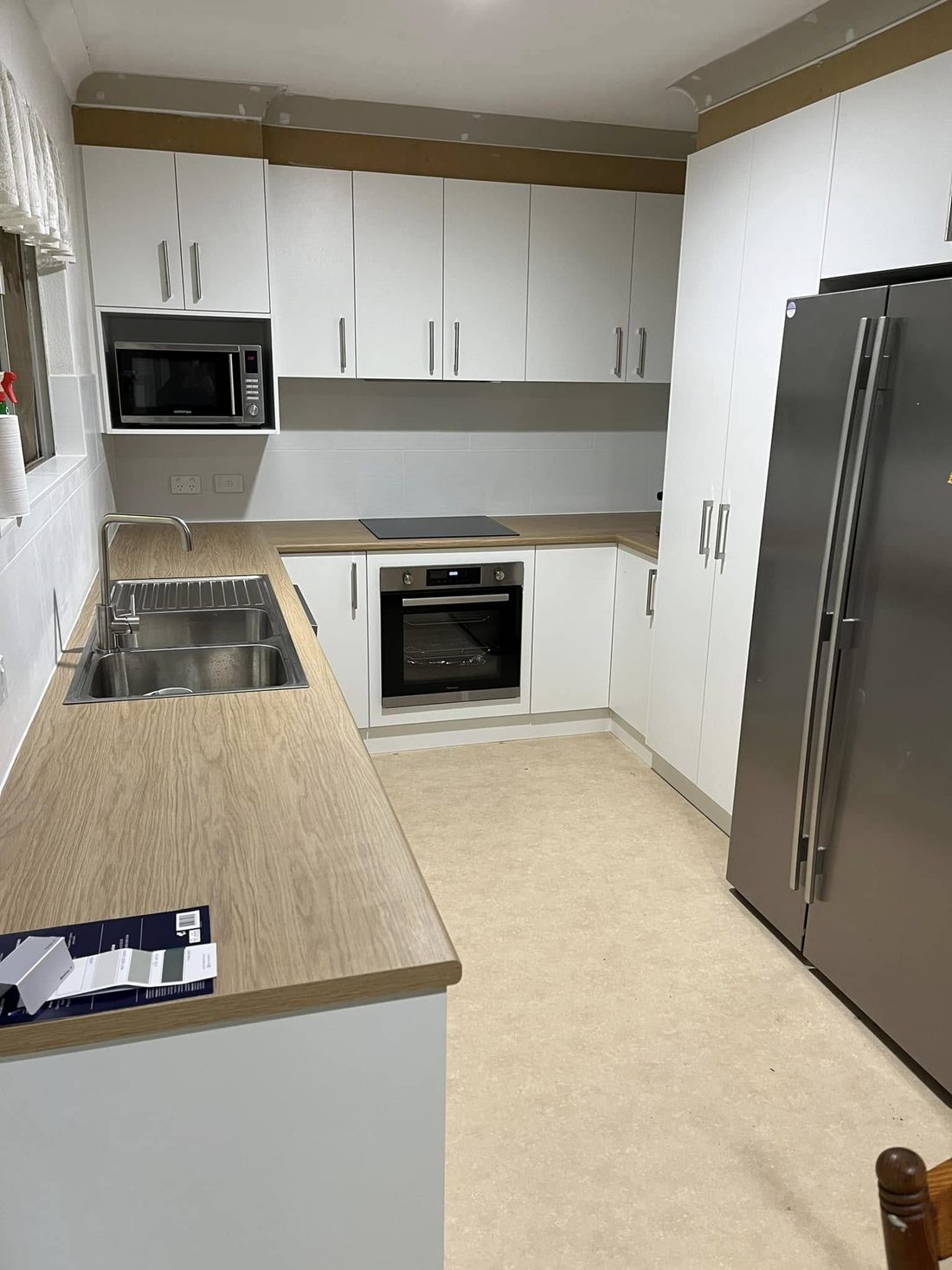 Kitchen after renovation by New Image Joinery — new custom cabinetry and benchtops