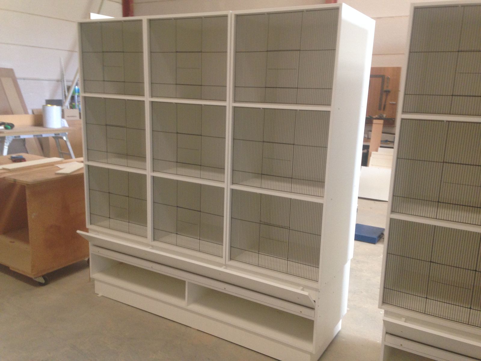 Large white open display shelving and storage unit