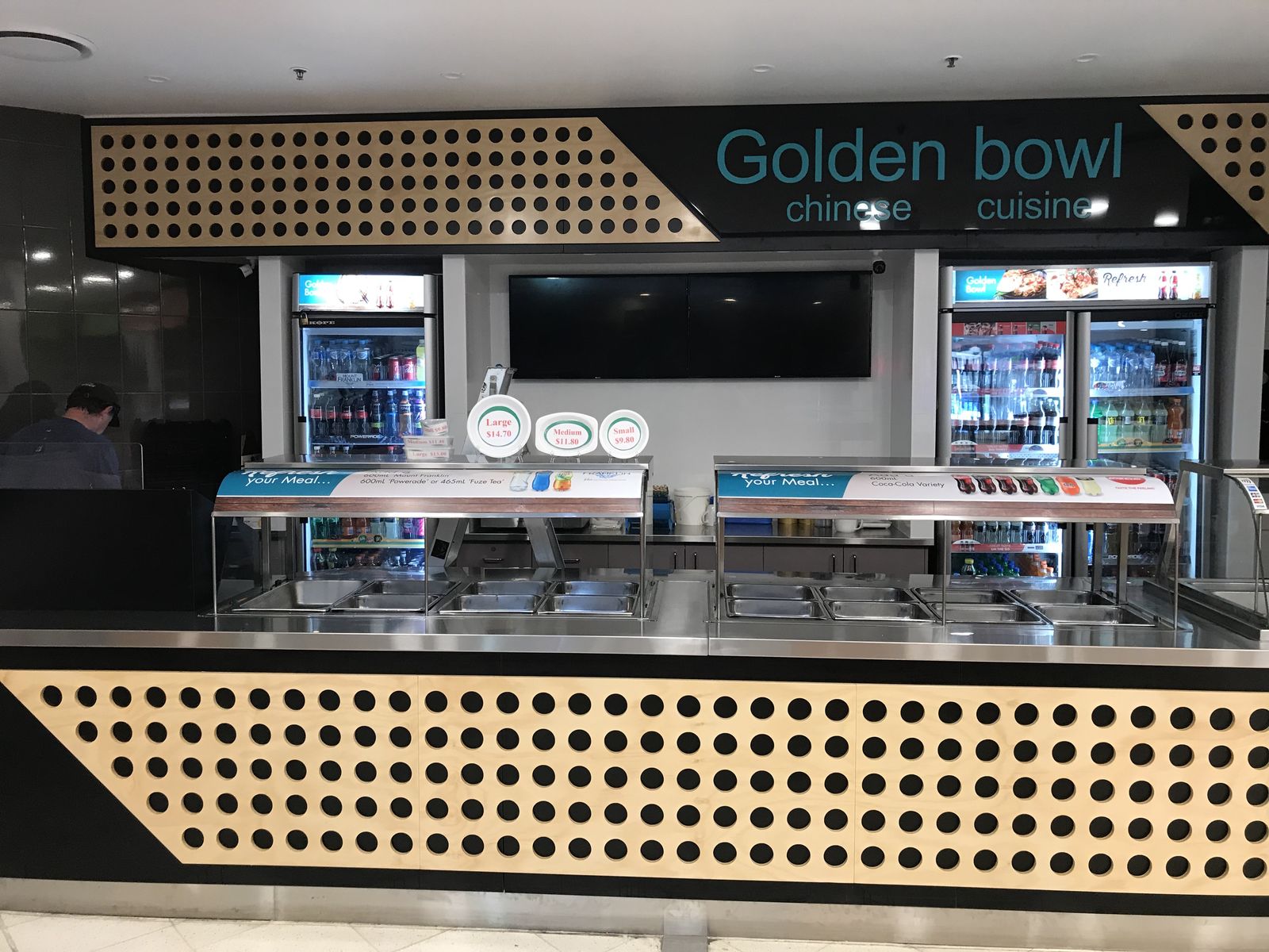 Restaurant food servery counter with rattan panelling and signage