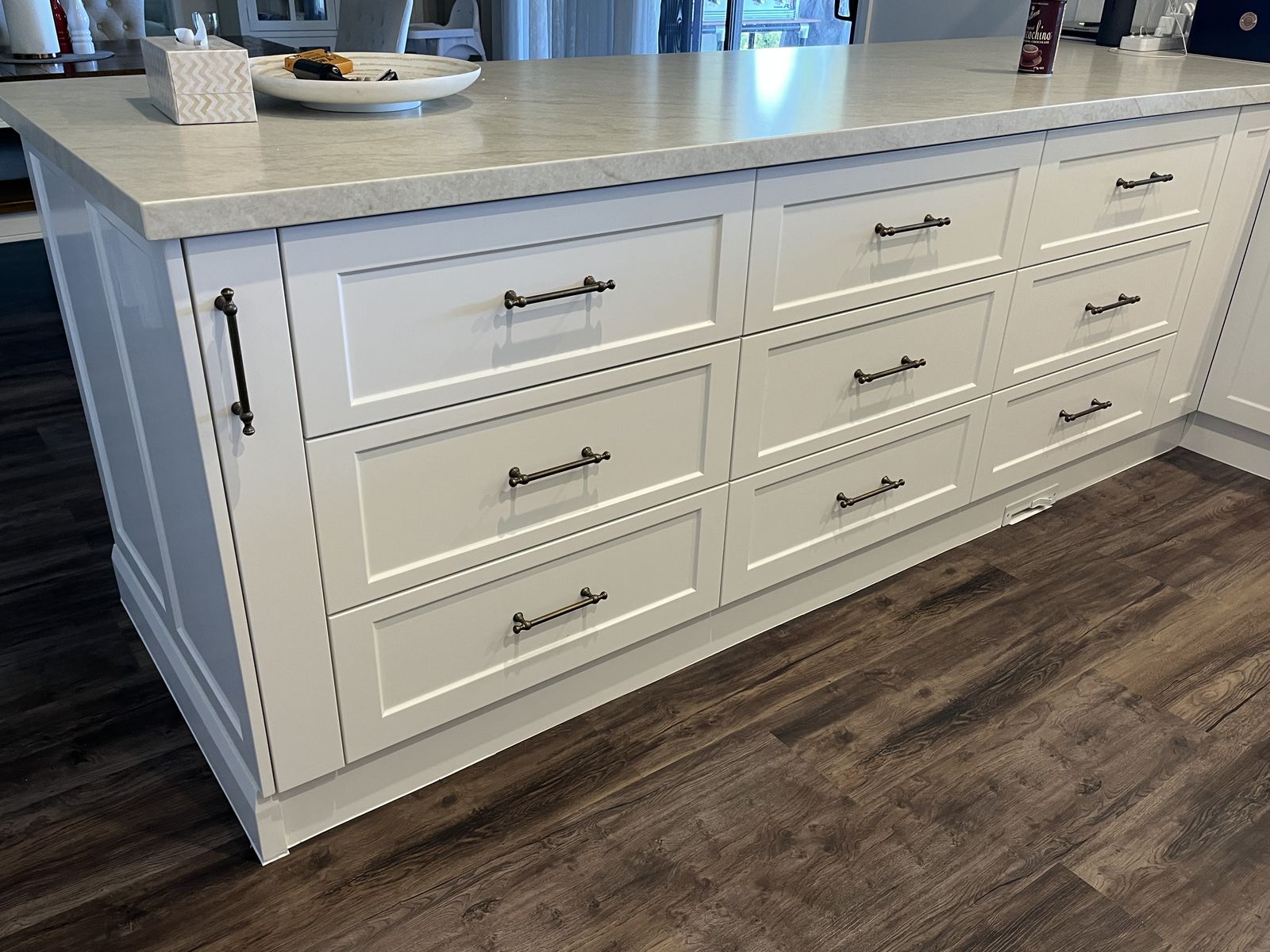 Large white island bench with deep pot drawers and stone benchtop