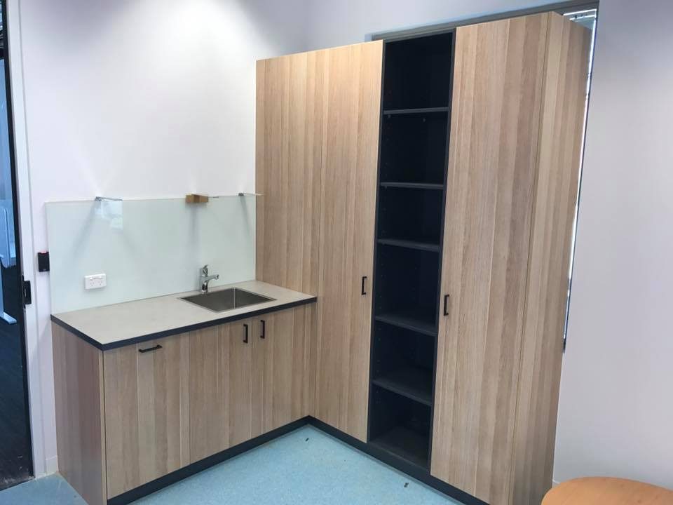 Full-height custom timber storage cabinetry with adjustable shelving
