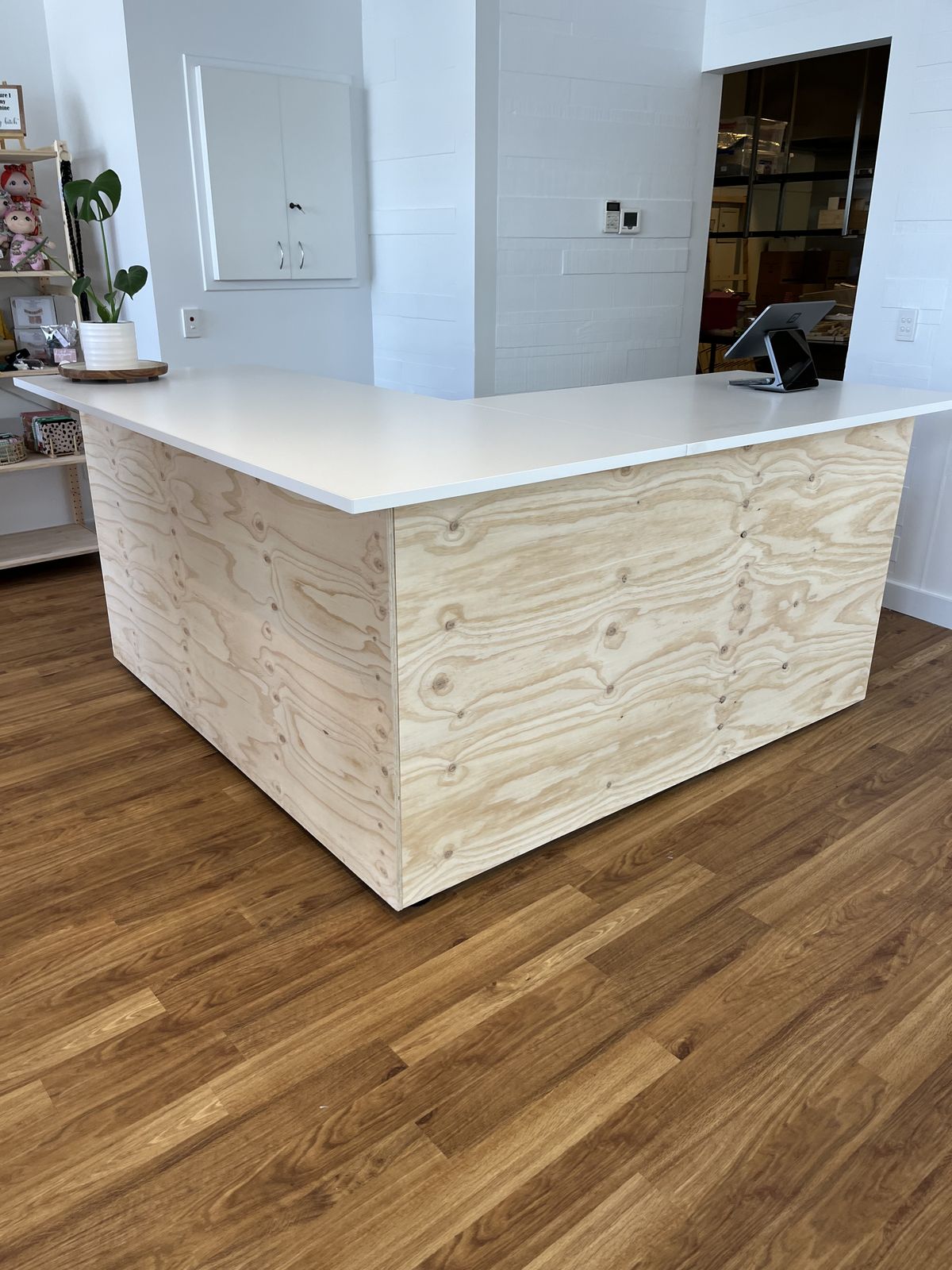 Reception desk build with white base and timber counter