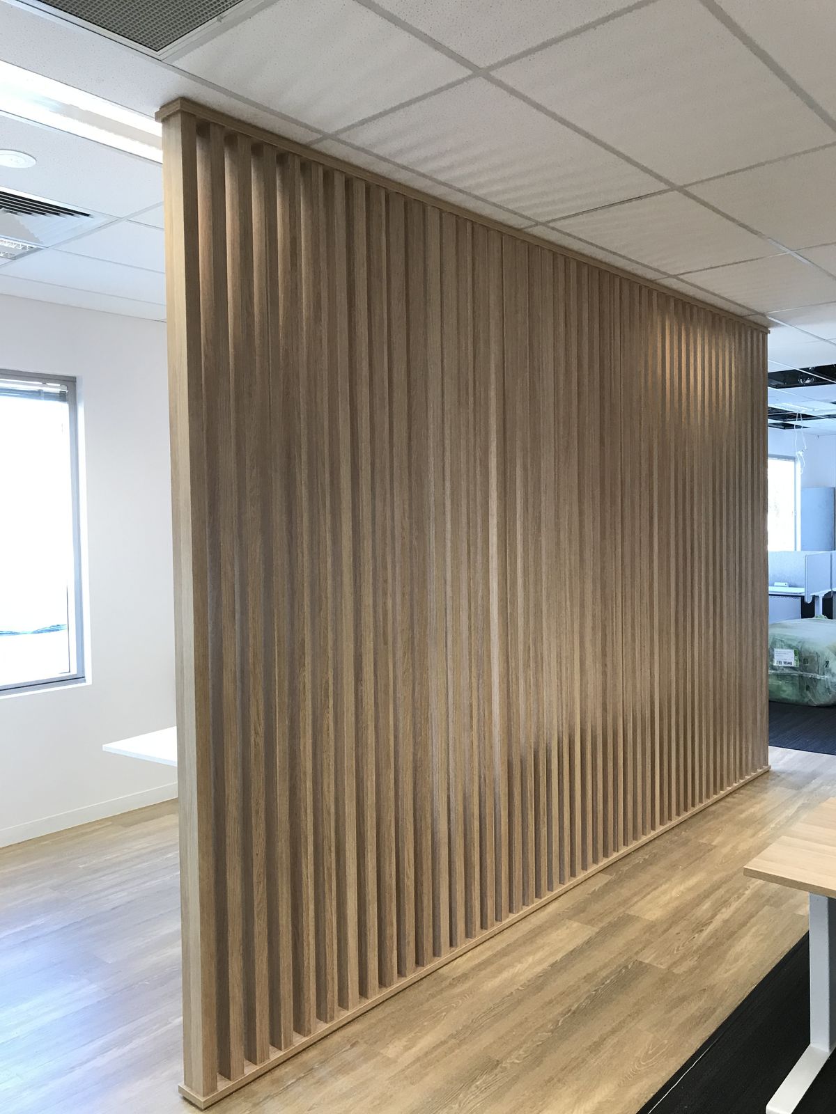 Floor-to-ceiling timber batten room divider joinery