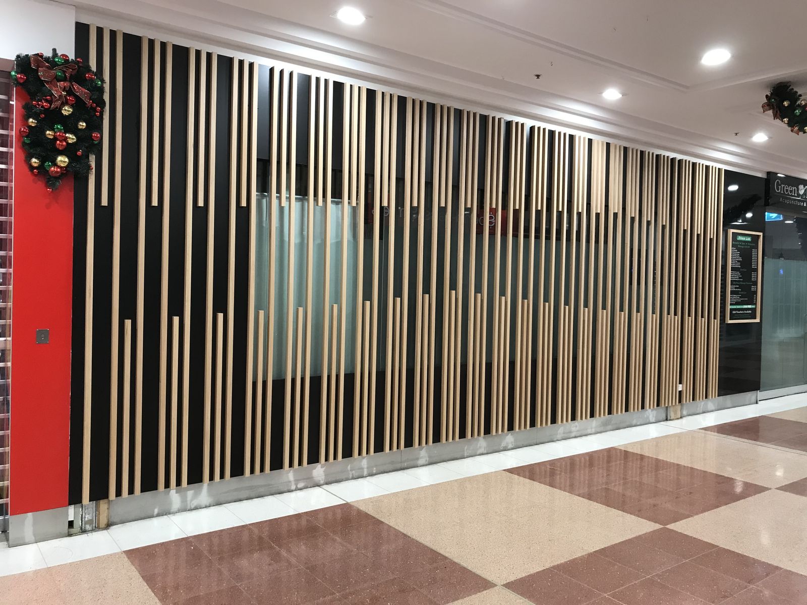 Timber batten feature wall lining a commercial corridor